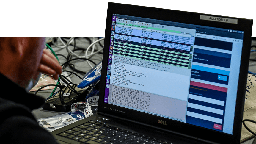 A person works at a computer during the 10th International Cybersecurity Forum in Lille