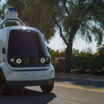 A Nuro autonomous car is seen driving down a road in Scottsdale, Arizona