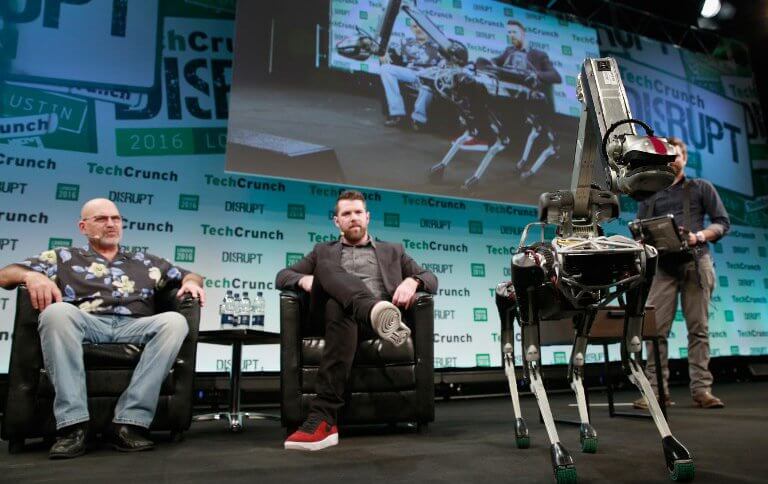 Marc Raibert, Founder of Boston Dynamics, TechCrunch Moderator Darrell Etherington and Boston Dynamics' Spot robot attend a Q&A during day 1 of TechCrunch Disrupt London at the Copper Box on December 5, 2016 in London, England.