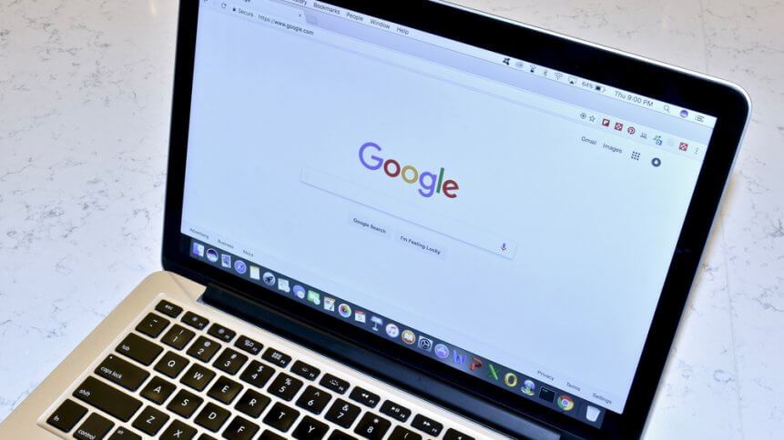 An Apple MacBook Pro displaying a Google search on the Google Chrome browser