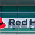 Red Hat logo and sign on open-source software company office in Silicon Valley