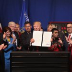 President Donald Trump signs an executive order to try to bring jobs back to American workers and revamp the H-1B visa guest worker program during a visit to the headquarters of tool manufacturer Snap-On in Wisconsin.