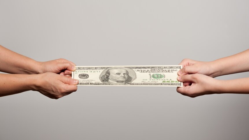 two pairs human hands stretching dollar bill shutterstock